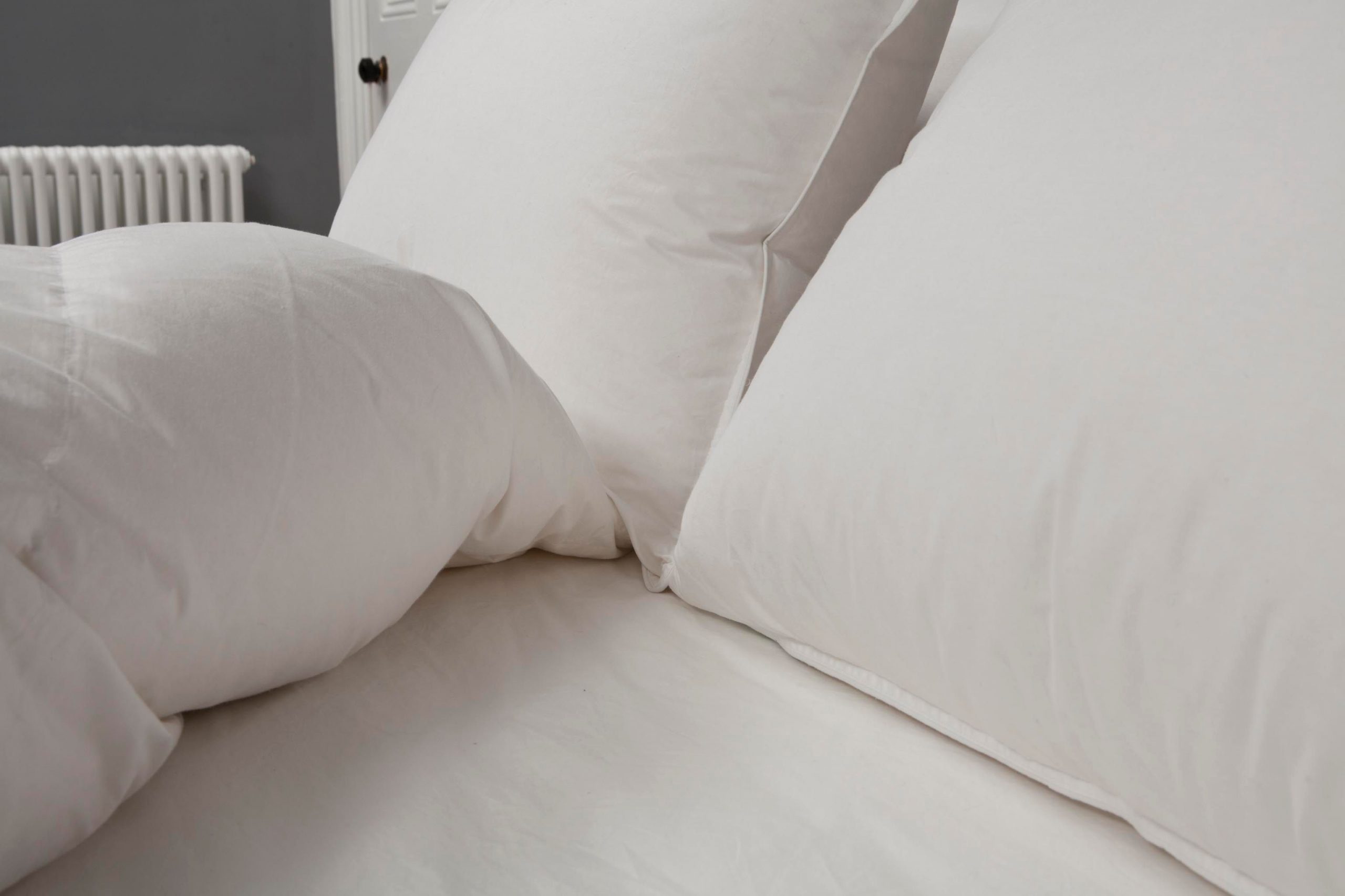 Cloud Nine Pillow on a bed